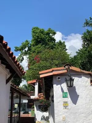 a building with a light on the side of it at Casa hotel Dulce Candelaria in Santa Fe de Antioquia