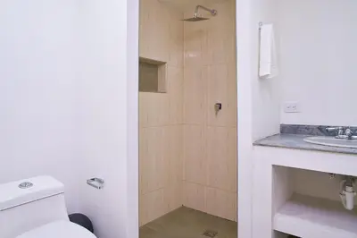 a bathroom with a toilet and a sink at Hotel Boutique Fiorentina Medellín in Medellín