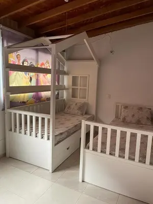 a bedroom with two bunk beds and a painting on the wall at no Reservar in Bello