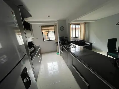 an aerial view of a kitchen and living room at no Reservar in Bello