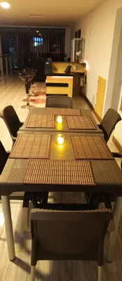 a group of tables in a room with chairs at Hotel Palo Grande in Manizales