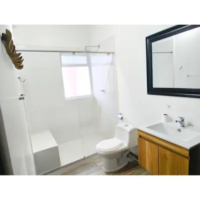 a bathroom with a shower and a toilet and a sink at Posada Campestre en Doradal in Puerto Triunfo
