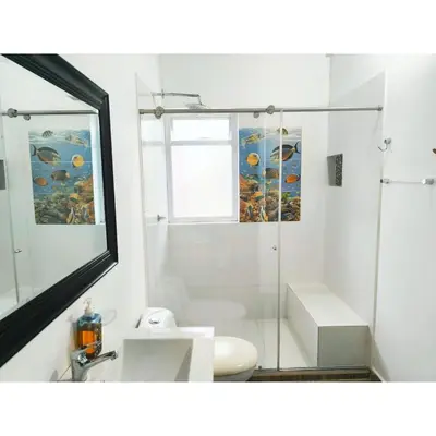 a bathroom with a shower and a toilet and a sink at Posada Campestre en Doradal in Puerto Triunfo