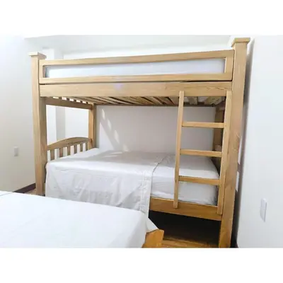 a bunk bed with a ladder next to two beds at Posada Campestre en Doradal in Puerto Triunfo