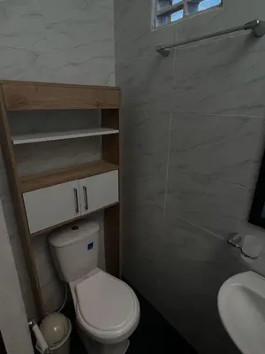 a small bathroom with a toilet and a sink at Loft Vacacional in Mariquita