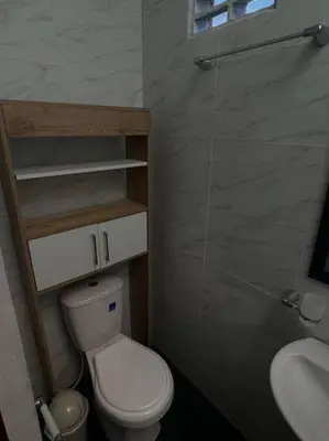 a small bathroom with a toilet and a sink at Apartamento Vacacional Campestre in Mariquita