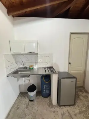 a kitchen with a sink and a stove at La torrecita in Barbosa