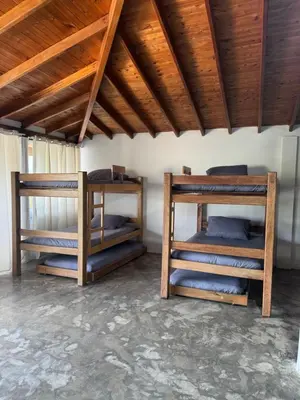 two bunk beds in a room with a wooden ceiling at La torrecita in Barbosa