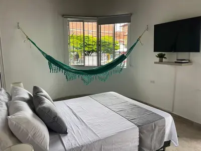 a bedroom with a bed and a window at Apartamento con vista a laureles 401 in Medellín