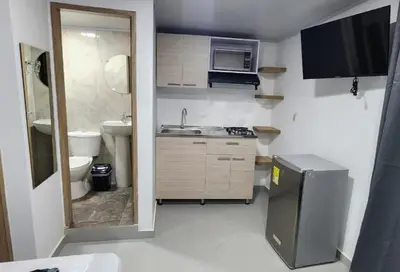 a small kitchen with a sink and a toilet at Aparta estudios Estadio la 80 in Medellín