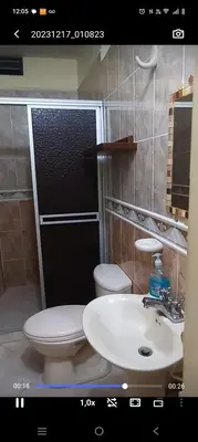 a bathroom with a white toilet and a sink at Casa en Doradal - Antioquia in Doradal