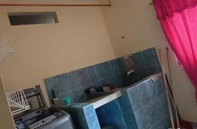 a bathroom with a blue tile wall and a sink at Casa en Doradal - Antioquia in Doradal