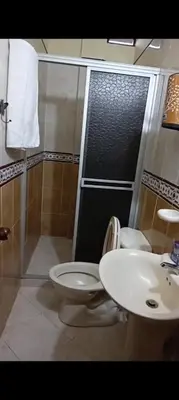 a bathroom with a toilet and a sink at Casa en Doradal - Antioquia in Doradal
