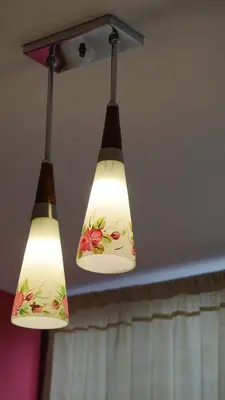 two lights are hanging from a ceiling at Ayenda Mountain Hostels Manizales in Manizales