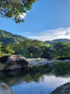 a body of water with trees in the background at Aracari Ecolodge in San Rafael