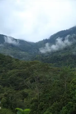 a view of a mountain with clouds in the valley at Aracari Ecolodge in San Rafael
