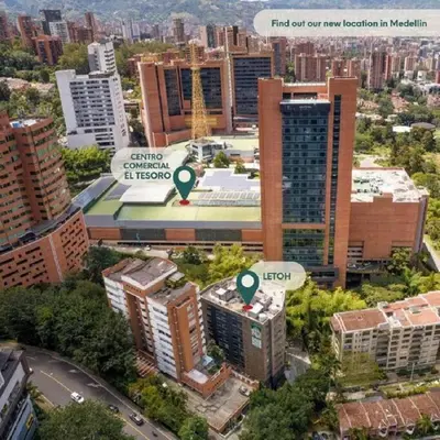 an aerial view of a city with tall buildings at El Tesoro Medellín Hab310 by Letoh in Medellín