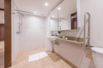 a bathroom with a shower and a sink and a toilet at El Tesoro Medellín Hab314 by Letoh in Medellín