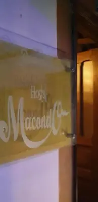 a sign for a hospitalacio nacional on a window at HOSTAL MACONDO in Manizales