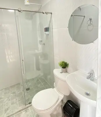 a bathroom with a toilet and a sink and a shower at Apartamento Balcón 302 in San Luis