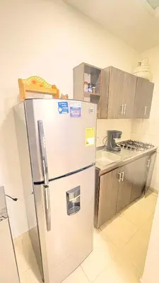 a kitchen with a stainless steel refrigerator and a counter at Apartaestudio sector la presentacion in Manizales