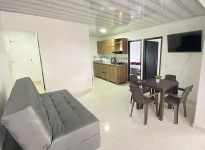 a living room with a couch and a table at Apartamento Balcón 201 in San Luis