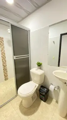 a bathroom with a toilet and a sink at Apartamento Balcón 201 in San Luis