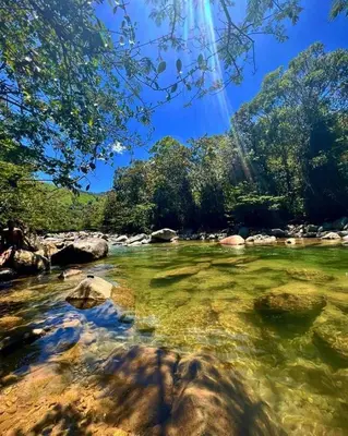 a river with rocks and trees in the background at Apartamento Balcón 201 in San Luis