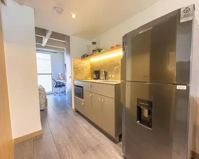 a kitchen with a stainless steel refrigerator at B 48 Living by B Rent in Medellín