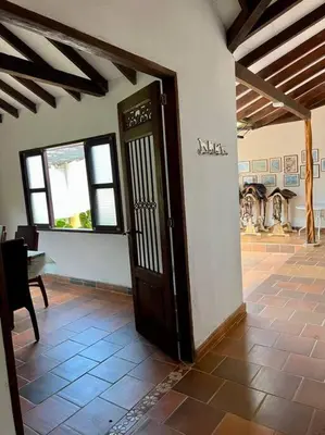 an open door in a room with a table at Finca Sierra Luz in Jericó