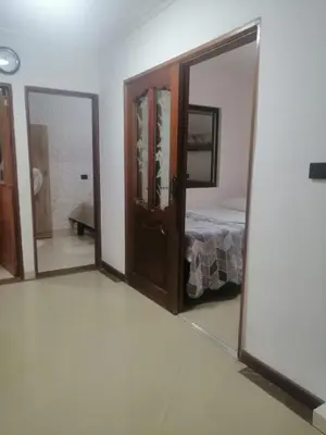 a room with a mirror and a bed in it at Apartamento Rionegro cerca a Aeropuerto in Rionegro