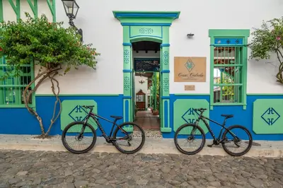 three bikes parked in front of a building at Casa Cedrela Hotel Boutique -Cauca Viejo- Mayores de 14 años in Jericó