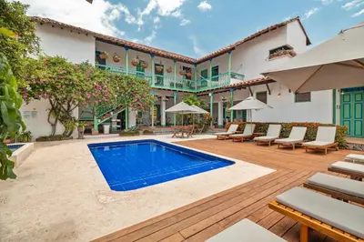 an exterior view of a house with a swimming pool at Casa Cedrela Hotel Boutique -Cauca Viejo- Mayores de 14 años in Jericó