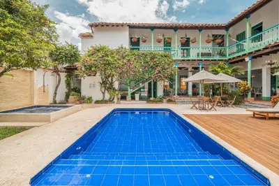 an exterior view of a house with a swimming pool at Casa Cedrela Hotel Boutique -Cauca Viejo- Mayores de 14 años in Jericó