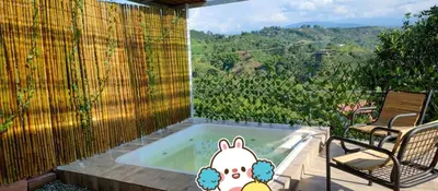 a jacuzzi tub with a view of a mountain at Chalet Lupe-Eje cafetero in Palestina