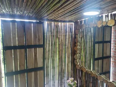 a room with a wooden wall with wooden barrels at Chalet Lupe-Eje cafetero in Palestina