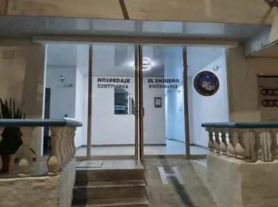 a lobby of a building with a glass door at HOSPEDAJE EL ENSUEÑO in Doradal