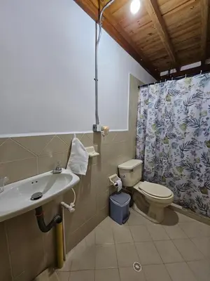 a bathroom with a sink and a toilet at Mirador del Lago, Rural House with ideal location in Marinilla