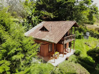 an overhead view of a small house with a roof at Mirador del Lago, Rural House with ideal location in Marinilla