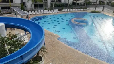 an overhead view of a large swimming pool at SANTAFE APARTASOLES in Santa Fe de Antioquia