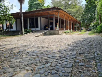 a house with a cobblestone street in front of it at Casa Vélez in Villamaría