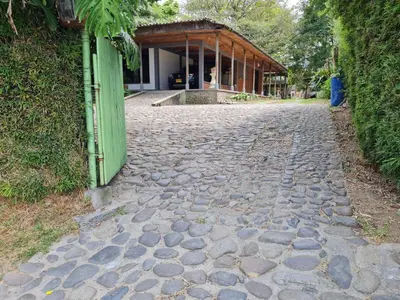 a cobblestone street with a building in the background at Casa Vélez in Villamaría