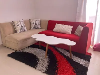 a living room with a couch and a table at La Casita De Colores in Guatapé