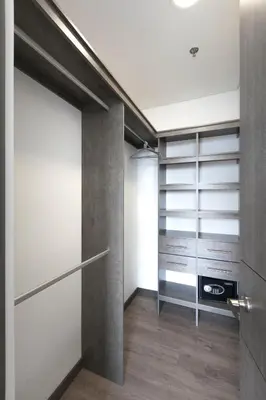 a walk in closet with a sliding door at Tropical Confort suite Poblado in Medellín