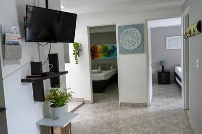 a living room with a flat screen tv on a wall at Apartamento Parque de Guatapé in Guatapé