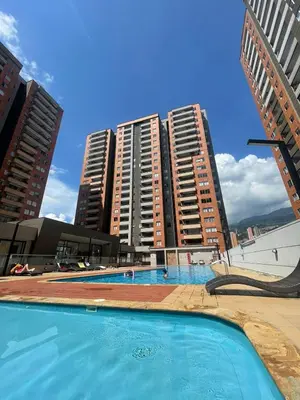 a swimming pool in front of some tall buildings at Habitación Masculina 1 persona en Apartamento Compartido Medellín in Medellín