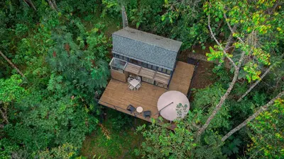 an overhead view of a house in the forest at Silvery Bungalows en el Bosque in San Carlos