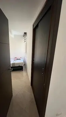 a hallway with a door leading to a bedroom at Apartamento en Bello in Bello
