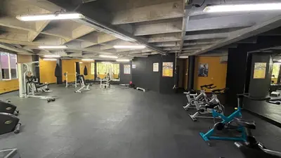 a gym with several treadmills and exercise bikes at Apartamento en Bello in Bello