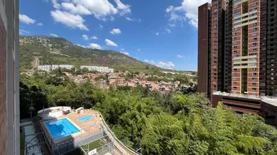 a view of a city from the balcony of a building at Apartamento en Bello in Bello